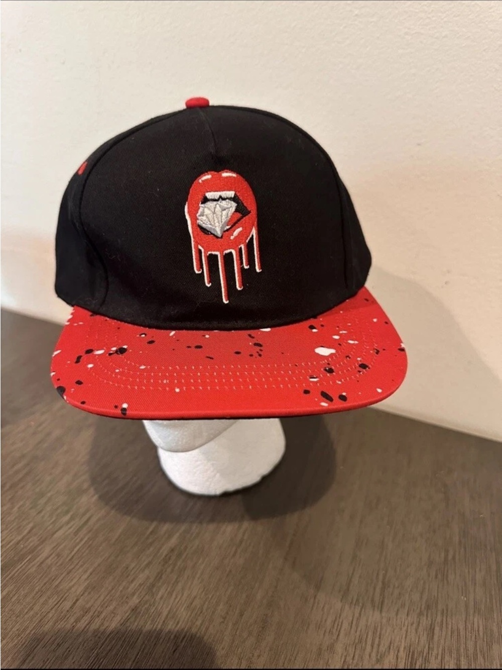 Black and Red Mens Snapback Hat with Dripping Lip Diamond Graphic
